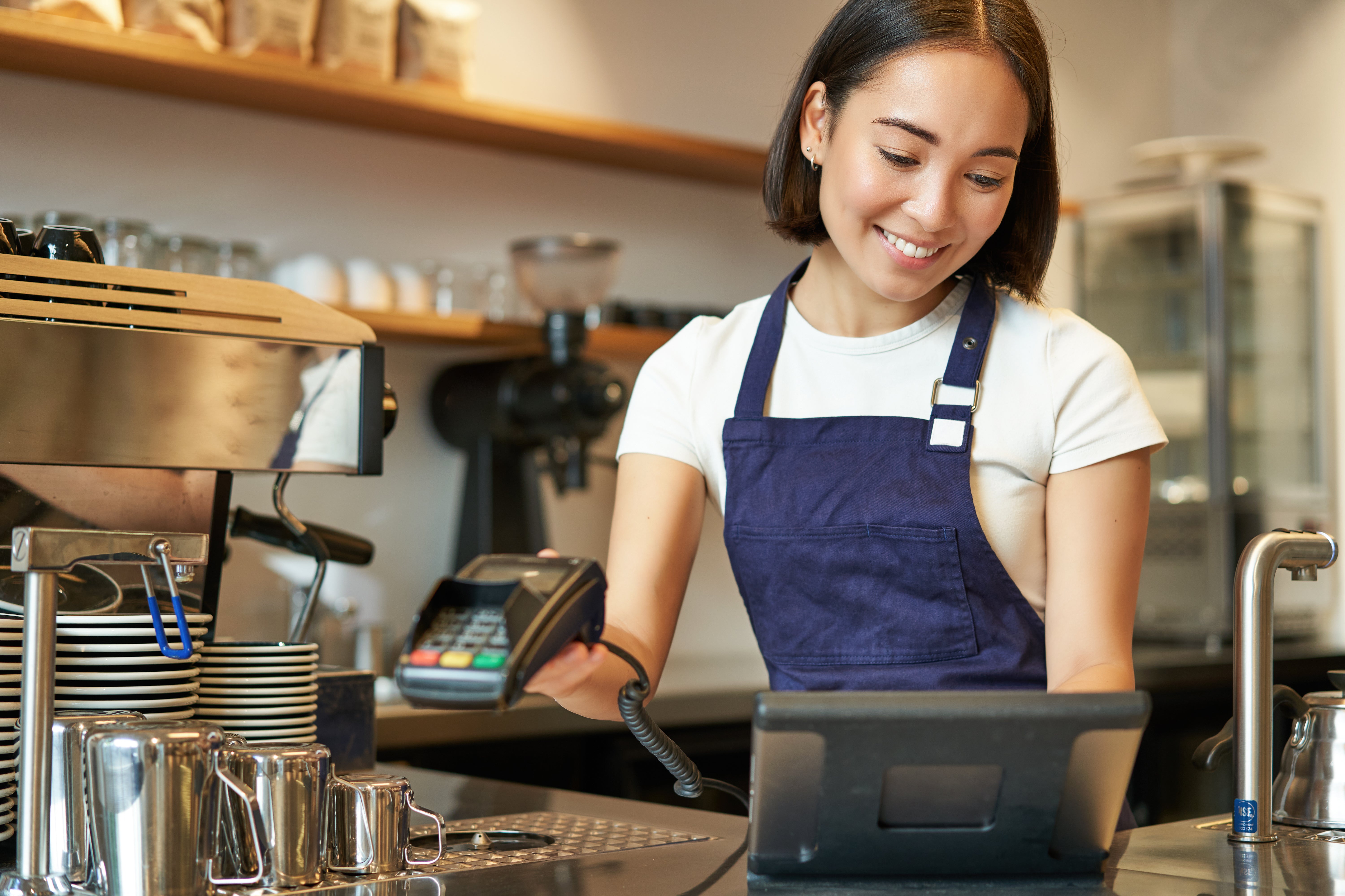 smiling-asian-barista-girl-processing-order-enter-order-pos-terminal-working-counter-coffee-shop.jpg__PID:71ecc4dc-b2dc-43a9-9208-ac2f29cf3075